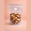 Nut House Brazil nuts in clear resealable pouch showing two-toned brown and ivory shells