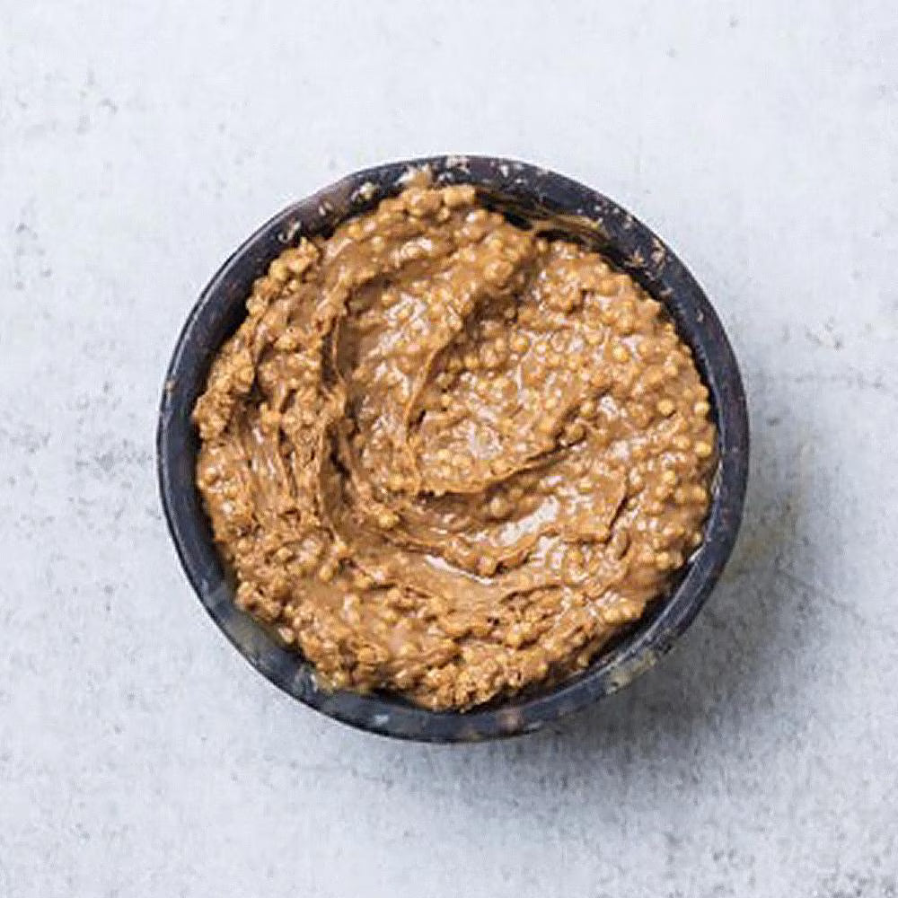 Cacao Barry Cara Crakine caramelised crunchy chocolate spread with golden-brown hue and visible cereal pieces