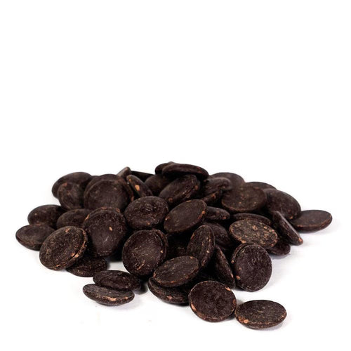 Pile of dark chocolate chips on a white background