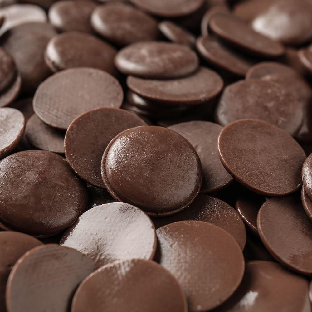Close-up of chocolate buttons with a brown color.