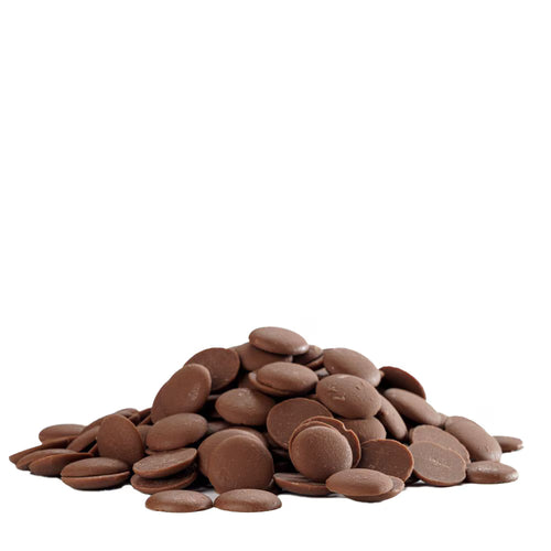 Stack of chocolate buttons on a white background