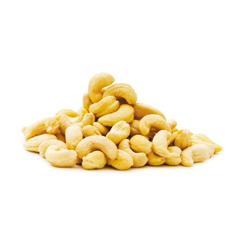 Loose mound of creamy beige whole kidney-shaped raw cashews on white background