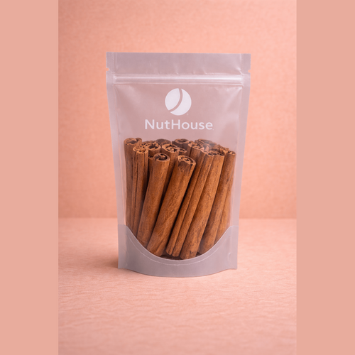Nut House cinnamon sticks in clear resealable pouch showing warm caramel-brown tightly rolled quills with textured bark