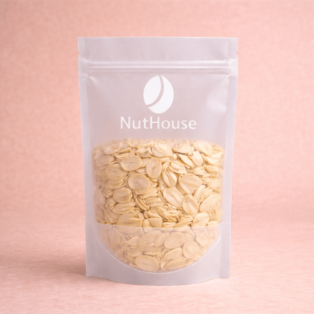 Nut House flaked almonds in white resealable pouch with transparent window showing pale ivory thin sliced nuts