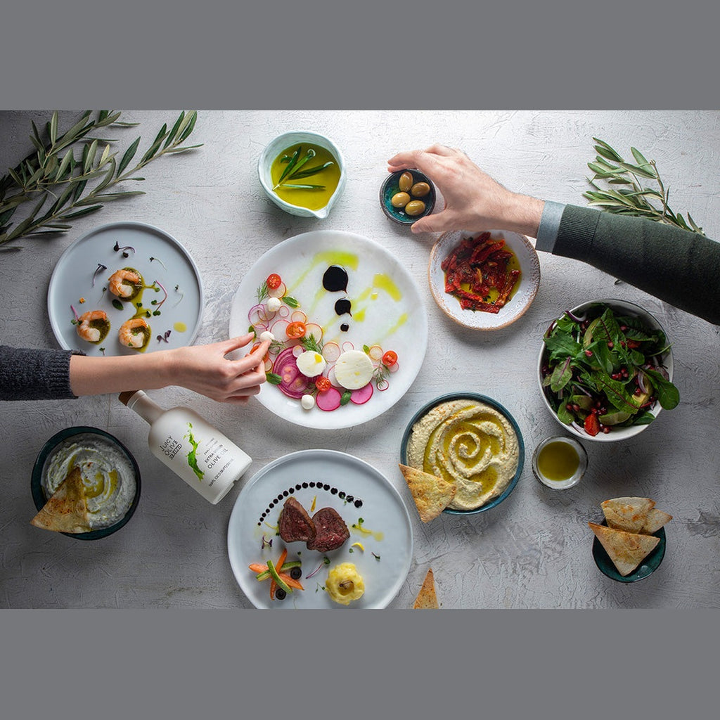 Juicy Olive Squeezed extra virgin olive oil drizzled over hummus and fresh salad dishes