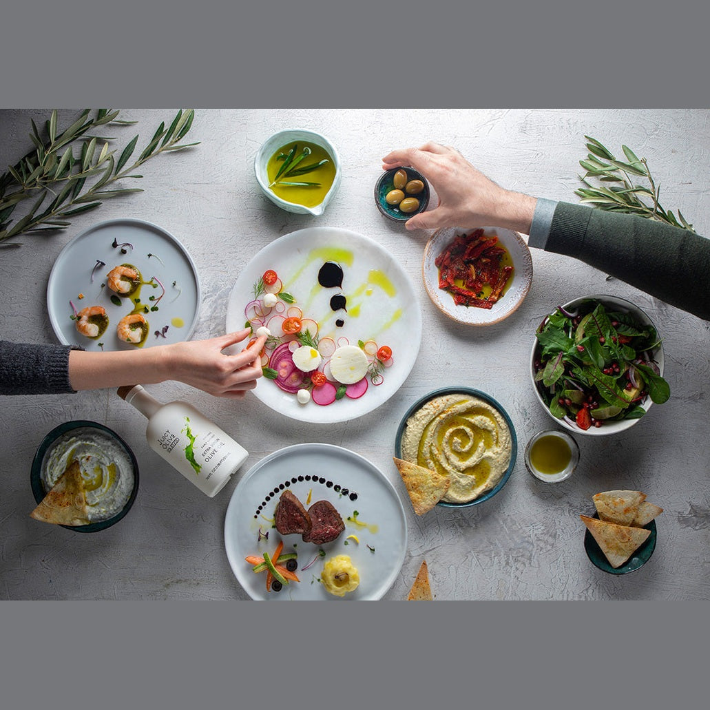 Juicy Olive Squeezed extra virgin olive oil drizzled over hummus and fresh salad dishes