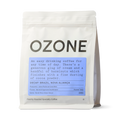 Ozone Decaf Brazil coffee bag with light blue label showing hazelnut and cocoa notes