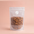 Nut House whole unshelled pecans in white resealable pouch with transparent window showing glossy brown nuts