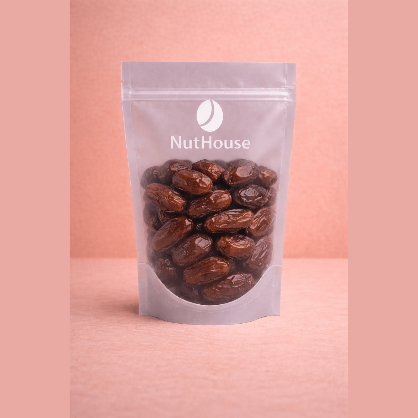 Nut House pitted dates in resealable pouch showing glossy dark brown sticky texture