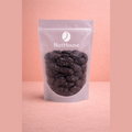 NutHouse Ashlock pitted prunes in resealable pouch showing plump dark brown wrinkled dried fruit