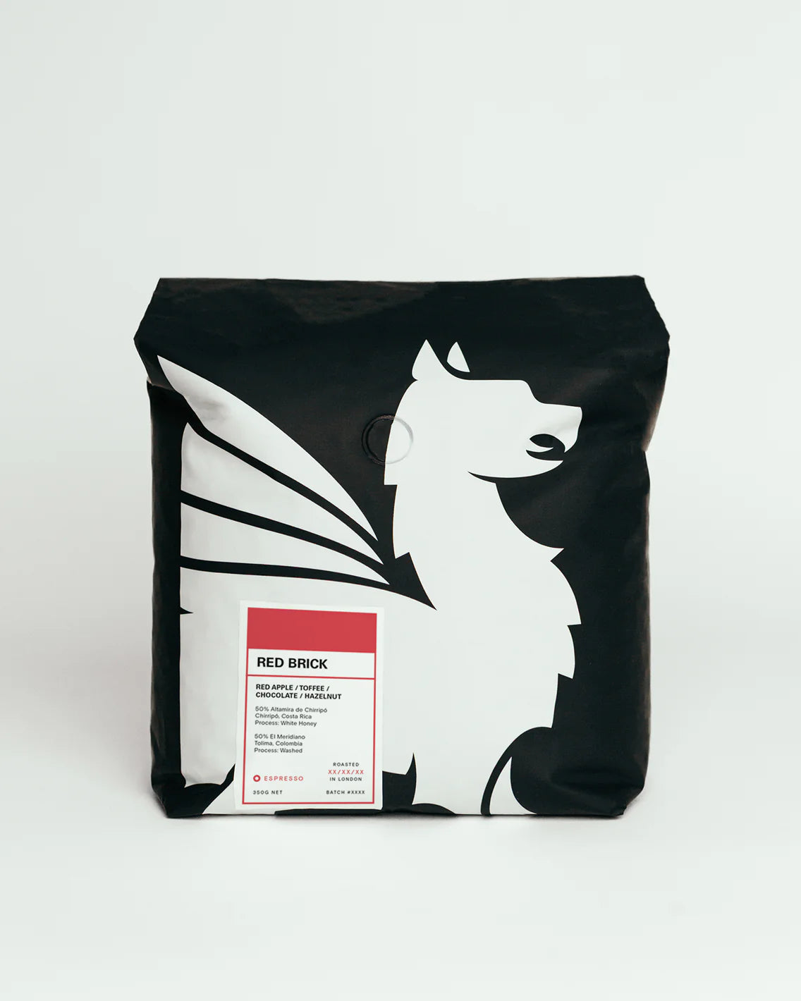 Black bag with white winged horse design and red label on a white background
