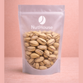 Nut House roasted salted pistachios in clear resealable pouch with visible pink kernels and salt dusting