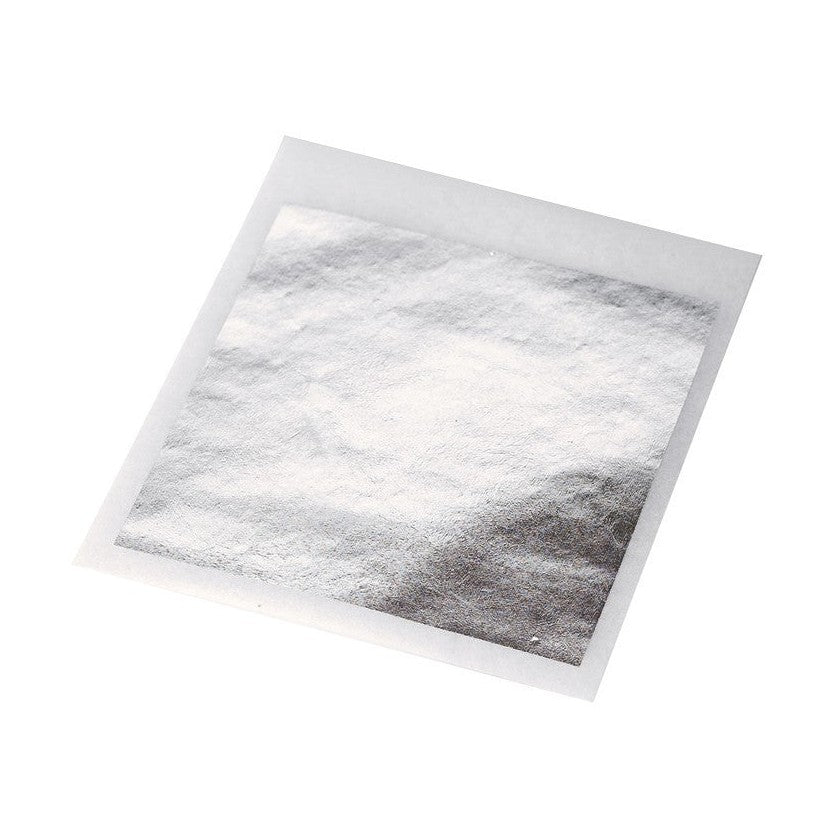 Nut House edible silver leaf sheet on white backing showing delicate metallic texture and lustrous sheen for patisserie decoration