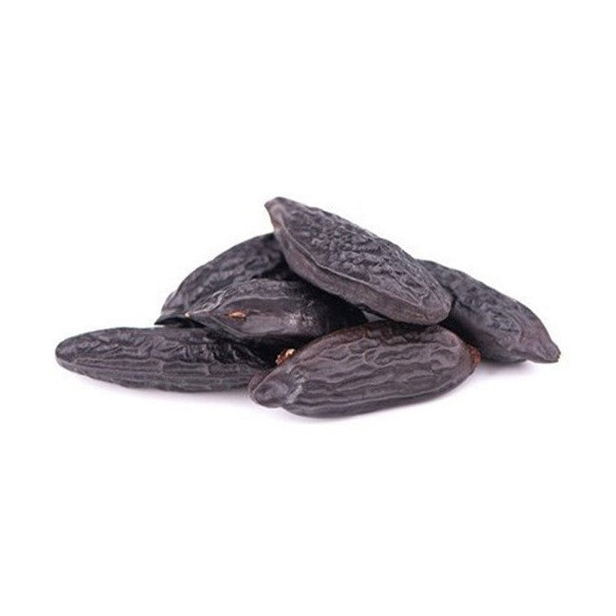 Terre Exotique jet-black wrinkled tonka beans close-up texture