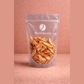 Nut House toasted coconut chips in clear resealable pouch showing wide golden-brown flakes with caramelized edges