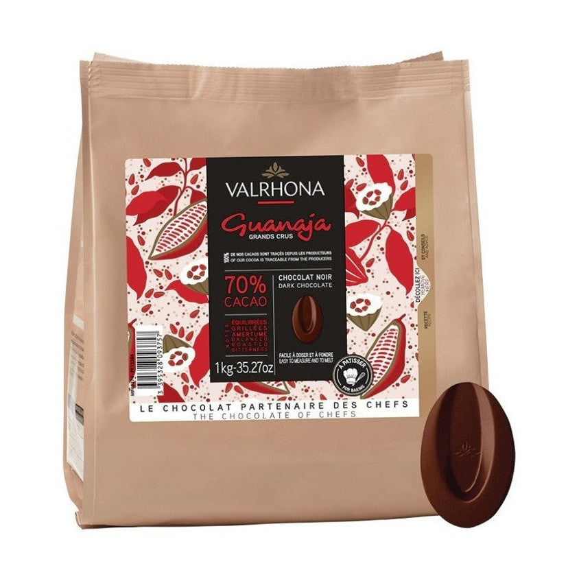 1kg Valrhona Guanaja 70% cocoa dark chocolate matte tan bag with red white botanical label and disc