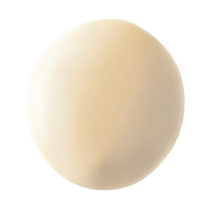 Valrhona Opalys creamy off-white chocolate disc showing high-opacity matte-glossy texture