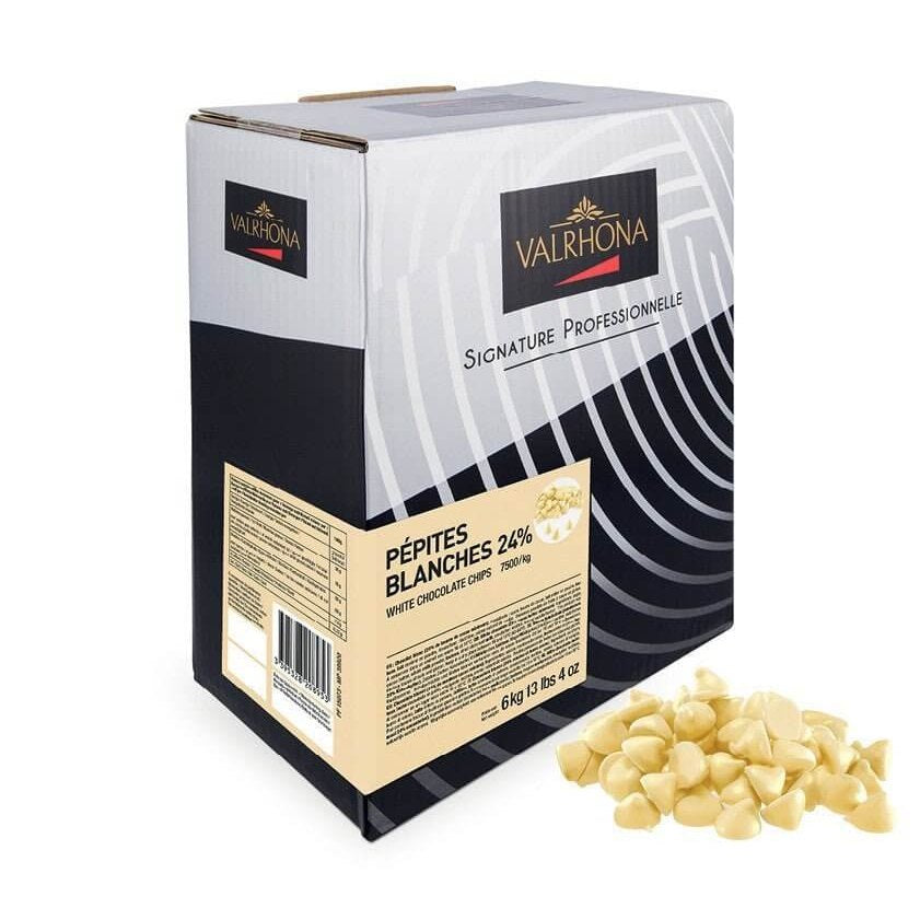 Valrhona Signature Professionnelle white chocolate chips 24% cocoa butter in 6kg box with scattered drops