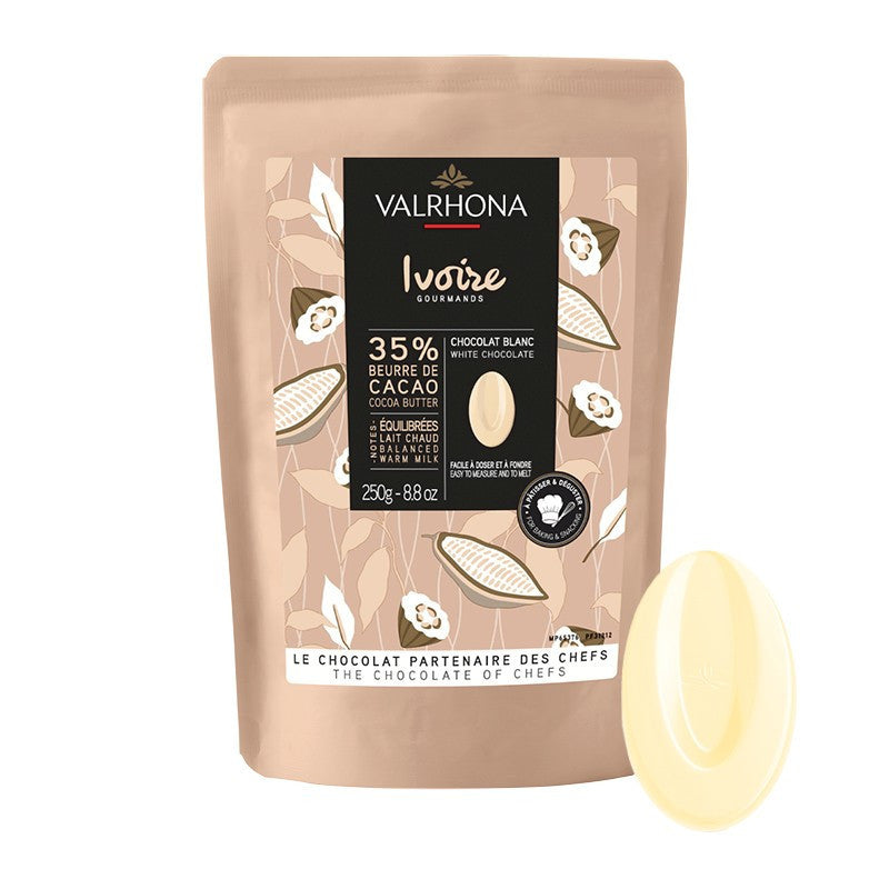 Valrhona white chocolate packaging with a piece of white chocolate on a white background